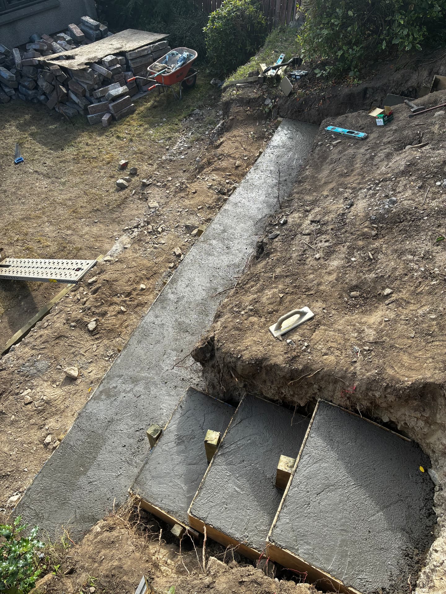 Freshly poured concrete foundations for steps on an Aberdeen groundworks project