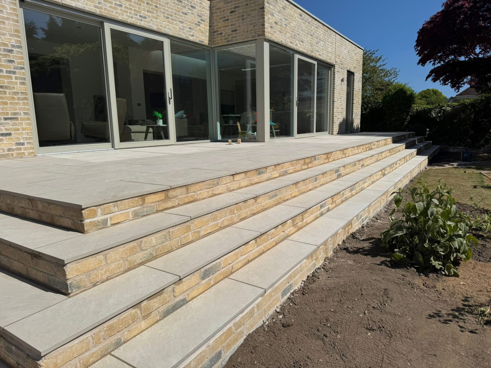 Stone steps and porcelain paving built by Gillies Construction at a house in Aberdeenshire